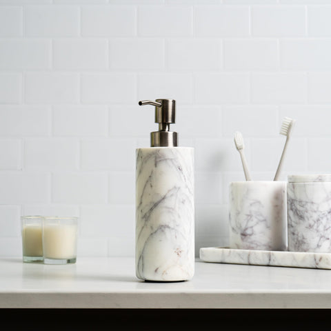 Cork & Mill dispenser on bathroom countertop complements modern decor and functionality.