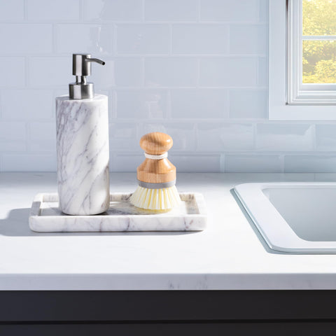 Close-up reveals natural veining in Cork & Mill marble dispenser.