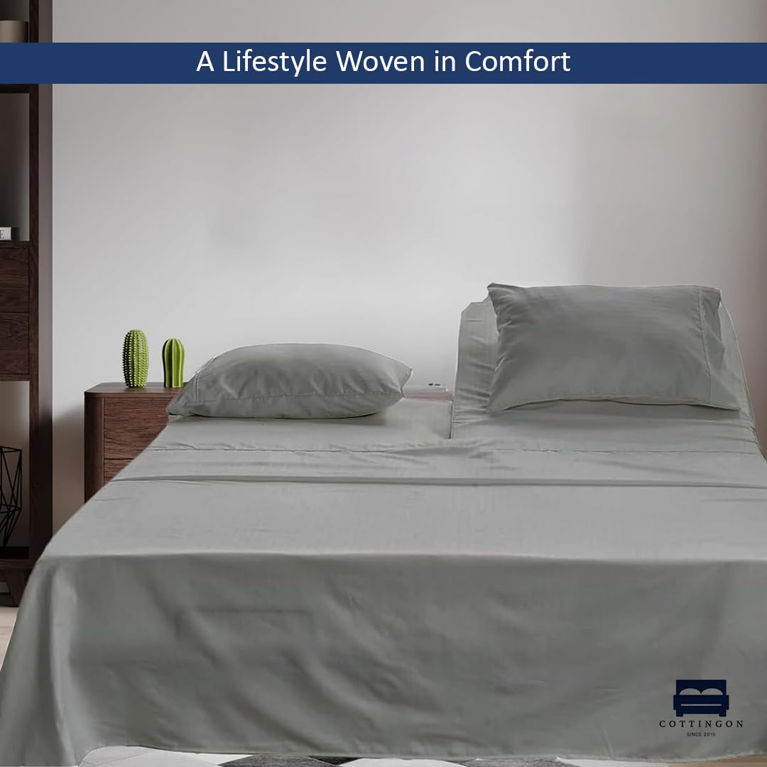 Cottingon pillowcases paired with a flat sheet for coordinated bedding set.
