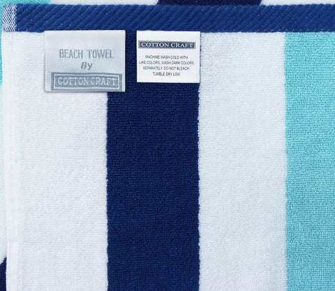 Cotton Craft towel drying after swim with plush underside and fast absorption.