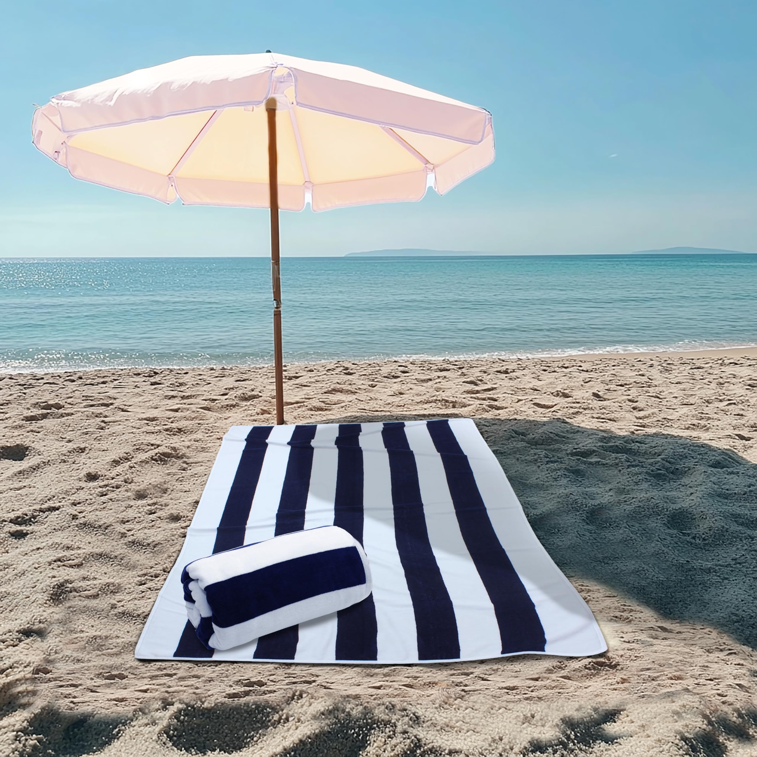 COTTON CRAFT Big Kahuna towel in Navy Cabana Stripe adds chic poolside style.