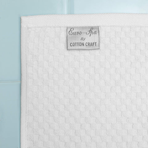 COTTON CRAFT Euro Spa towels on bath rack, oversized 30x56 for full-body coverage.