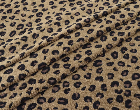Leopard-print design on a COTTON CRAFT bath towel adds decor appeal.
