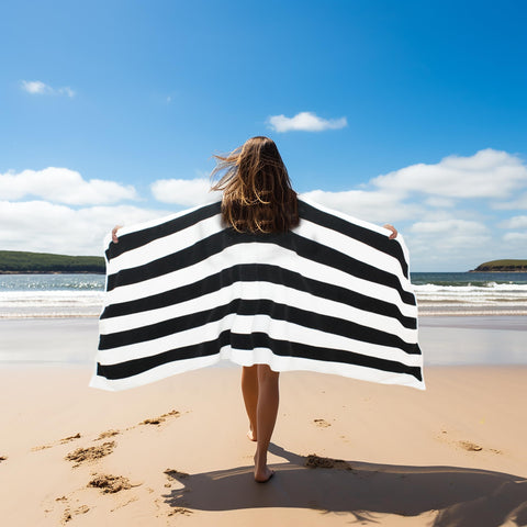 Towel draped on a lounge chair by COTTON CRAFT for chic comfort