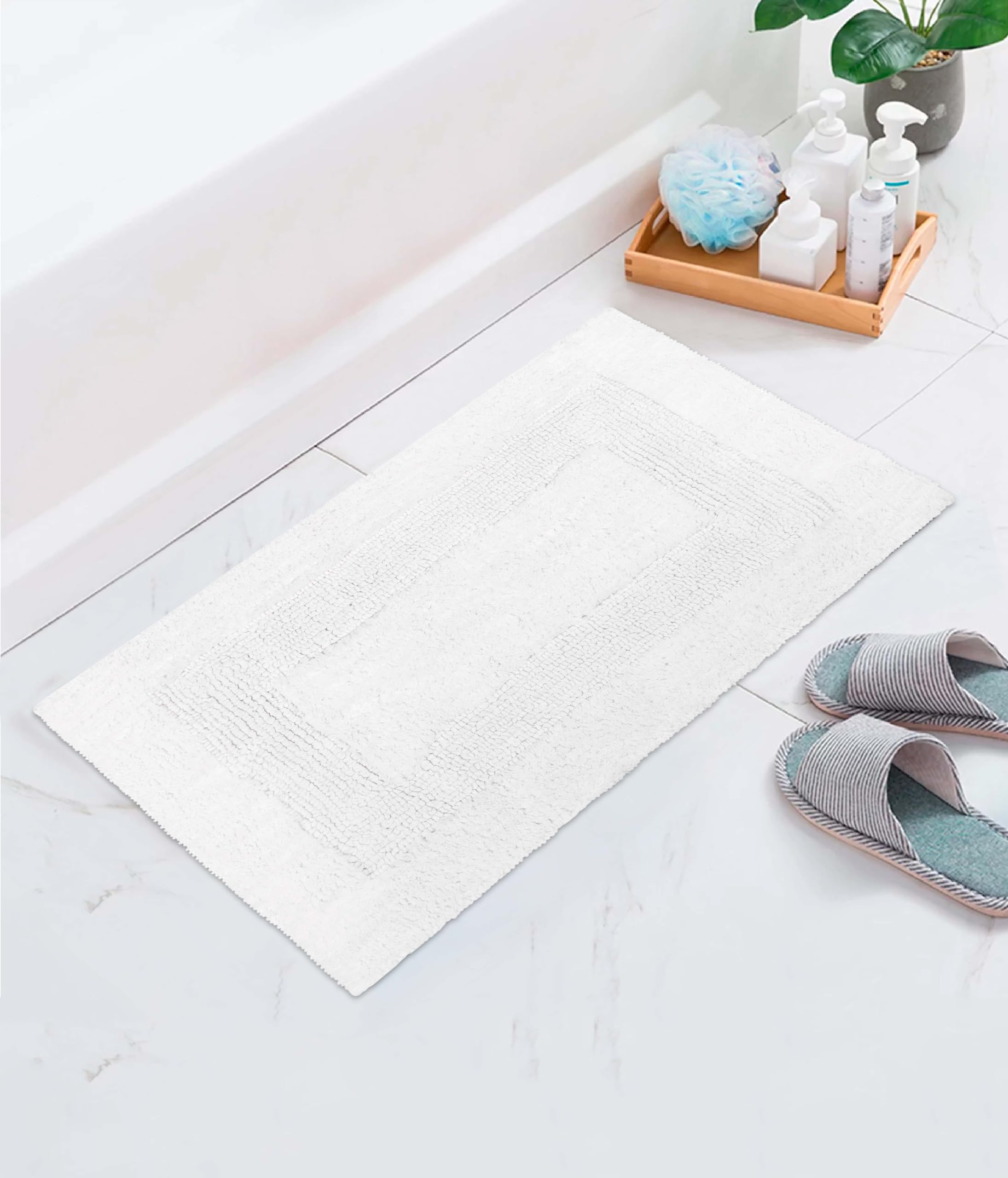 Cotton Craft machine-washable bath mat for easy maintenance.