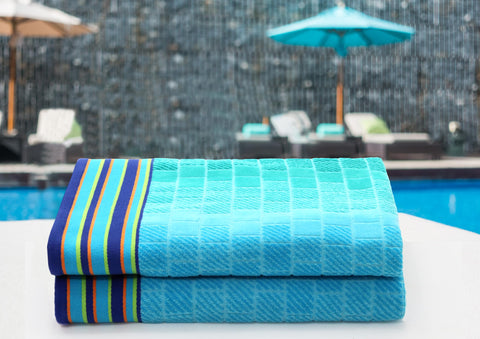 COTTON CRAFT two-towel pack in blue tiles for poolside use.