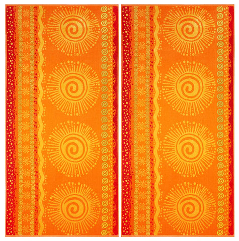 Cotton Craft oversized XL beach towel 39x68 on sand, ideal for sunbathing and lounging.