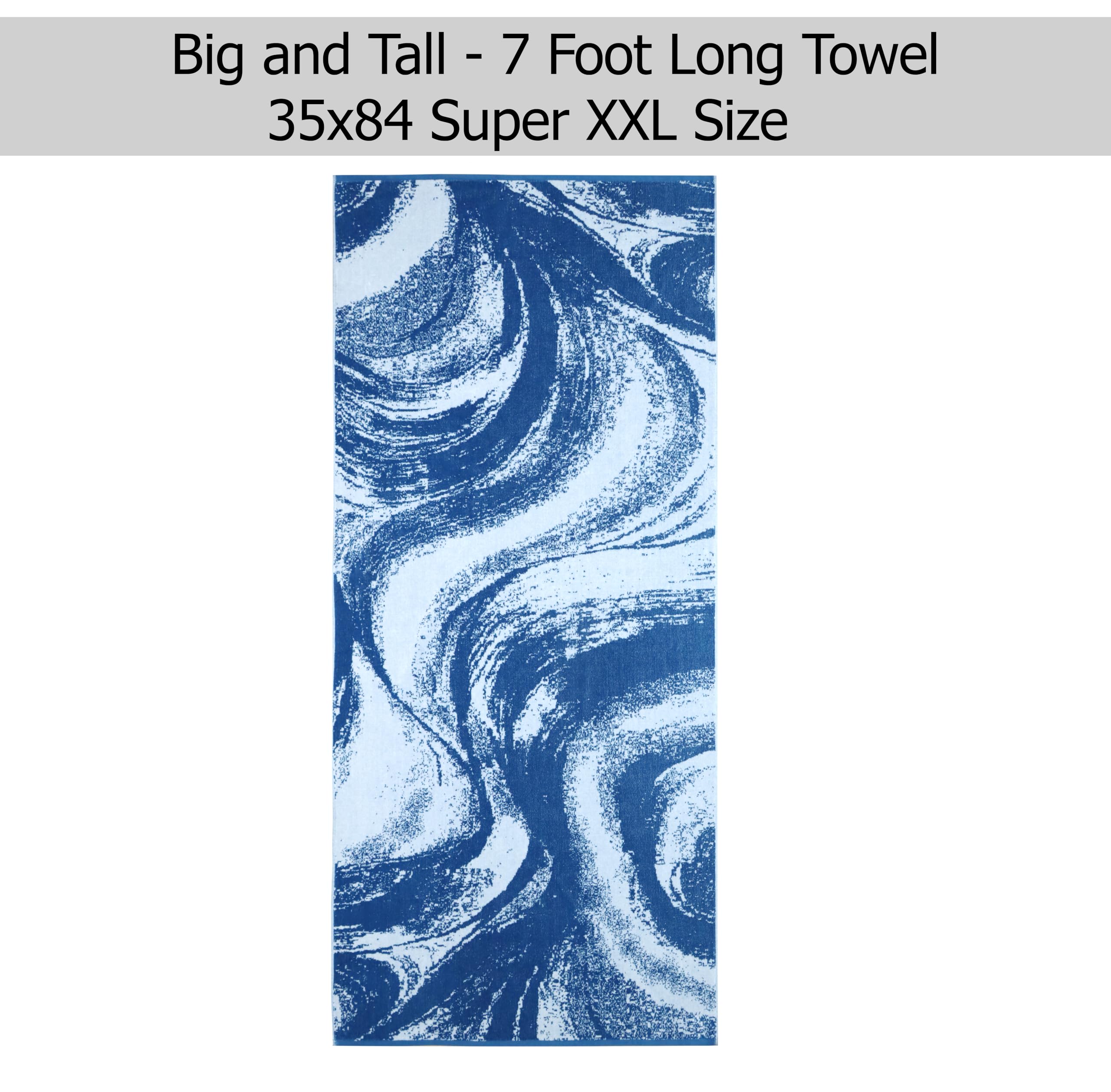 Cotton Craft large beach towel rolled for travel and easy packing.