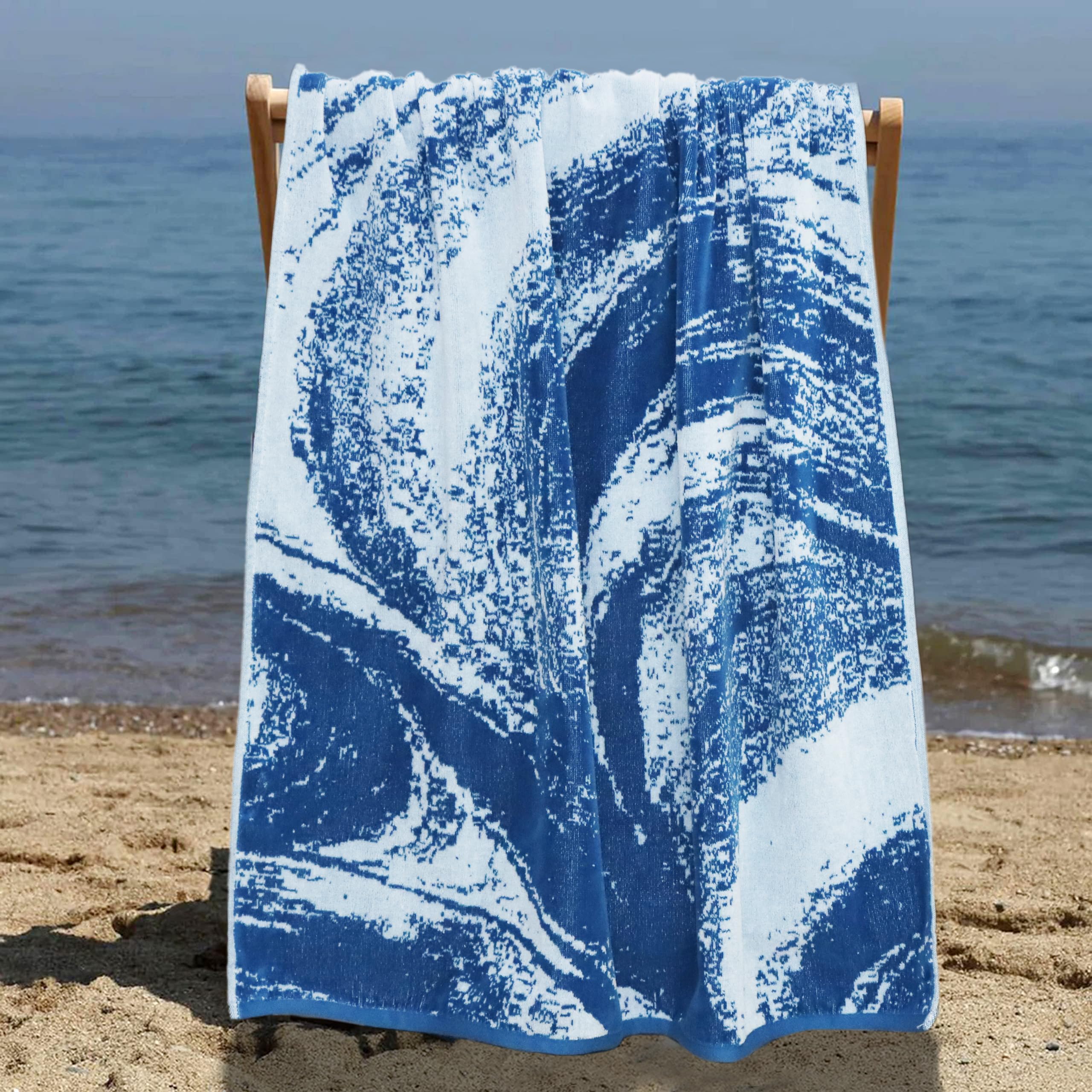 Cotton Craft oversized blanket-like towel used as a picnic or spa wrap.