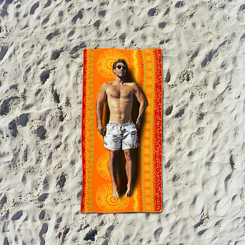 Cotton Craft beach towel in use on lounge chair for relaxing outdoor moments.