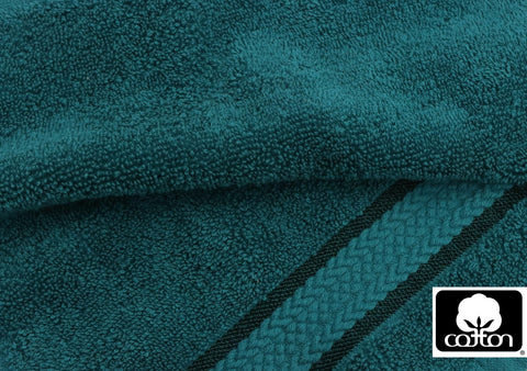 COTTON CRAFT teal towels close-up shows 580 GSM plush thickness for premium feel.