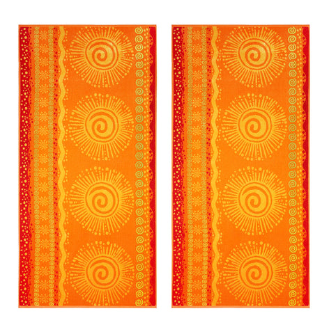 Cotton Craft vibrant yellow towel draped on chair for poolside comfort.