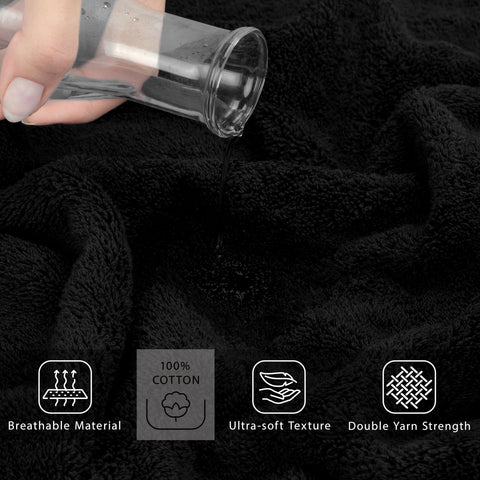 Cotton Paradise coal black towel displayed in a spa-like bathroom setup