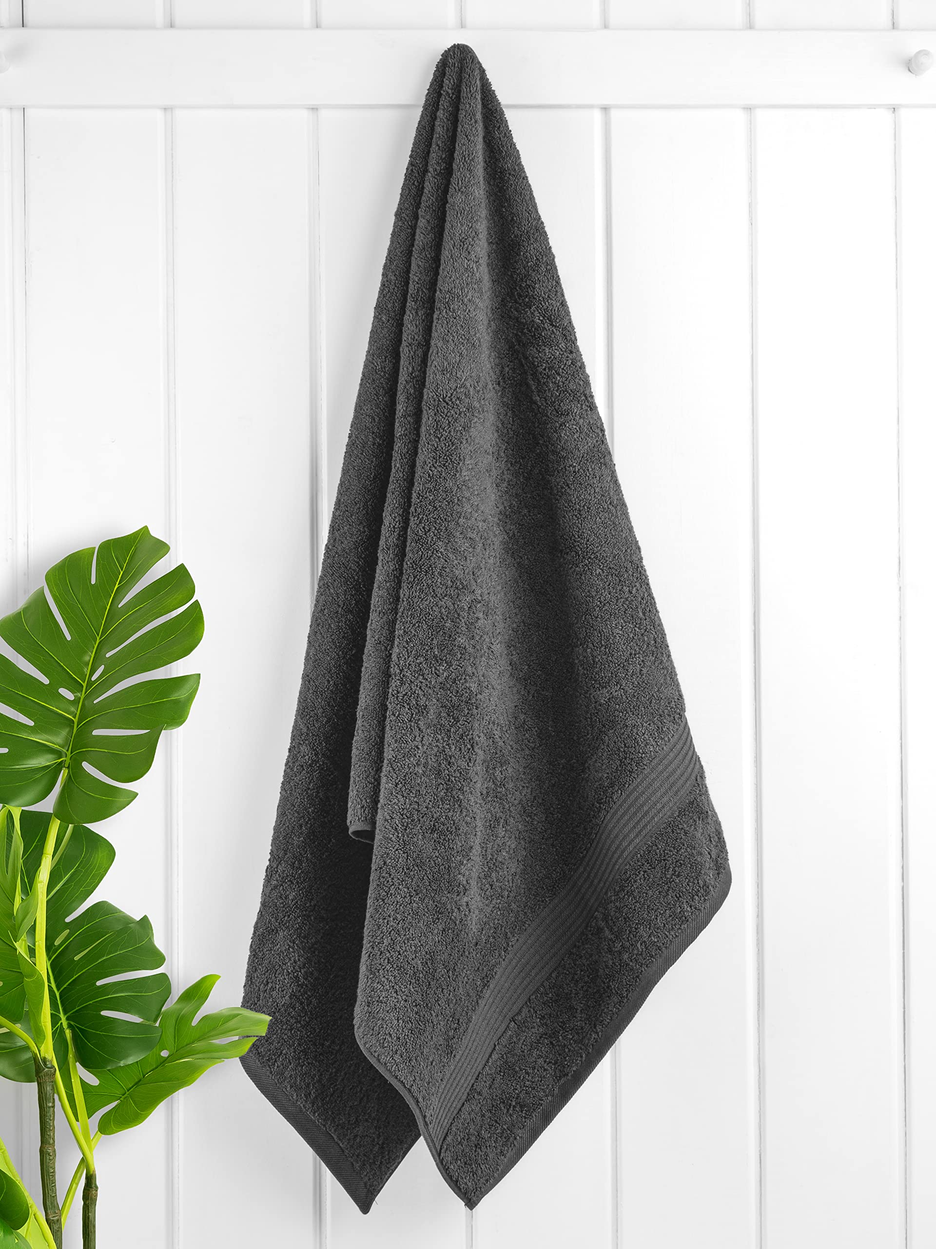 Cotton Paradise towels folded neatly, showing thick 600 GSM texture.