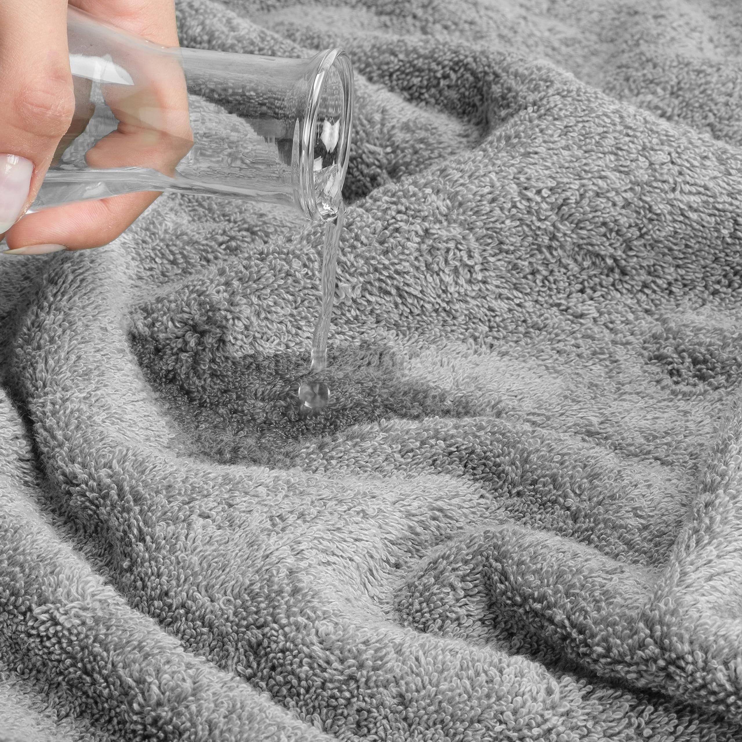 Cotton Paradise gray towel set draped in a bathroom for spa-like comfort.