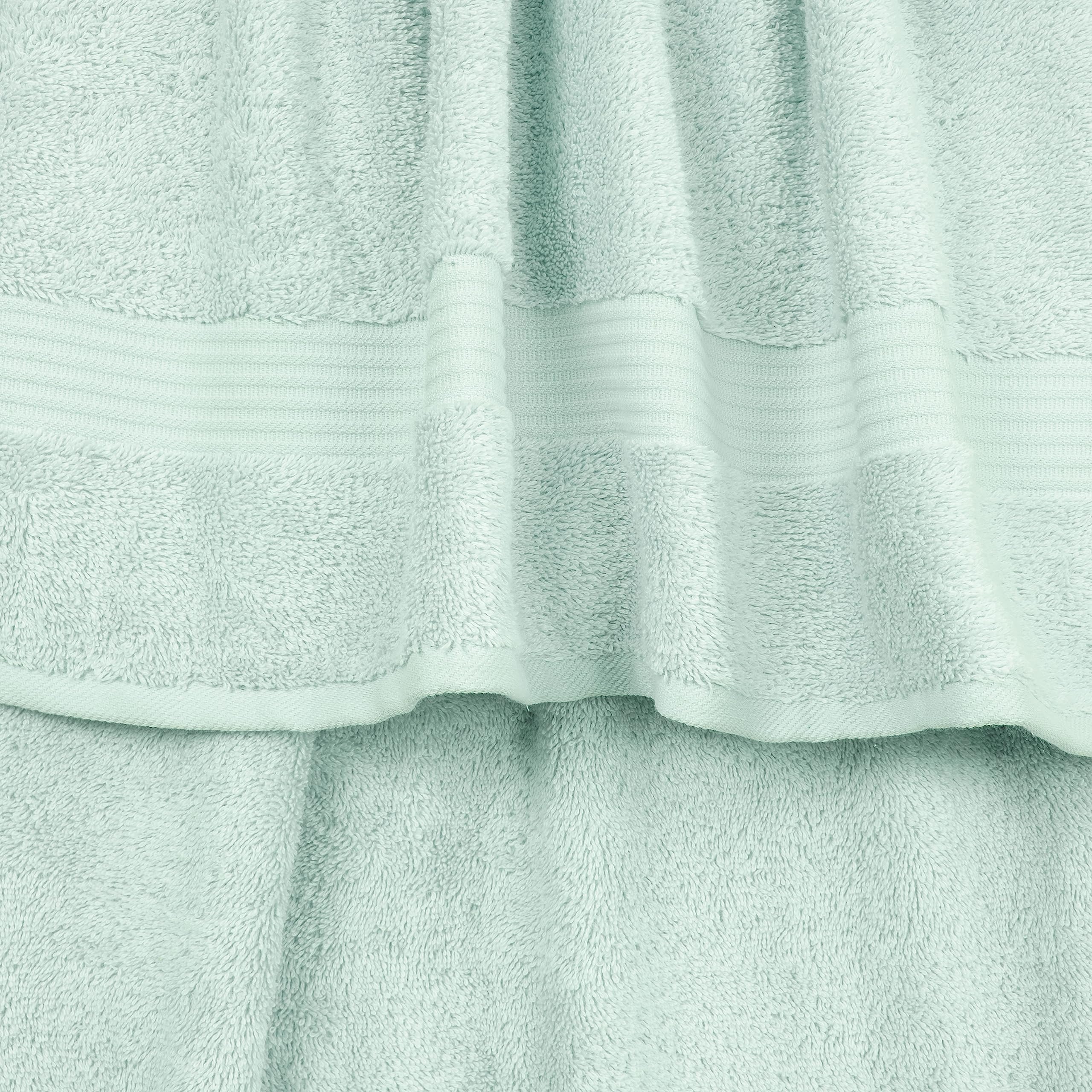 Two mint hand towels ready for daily use and guests