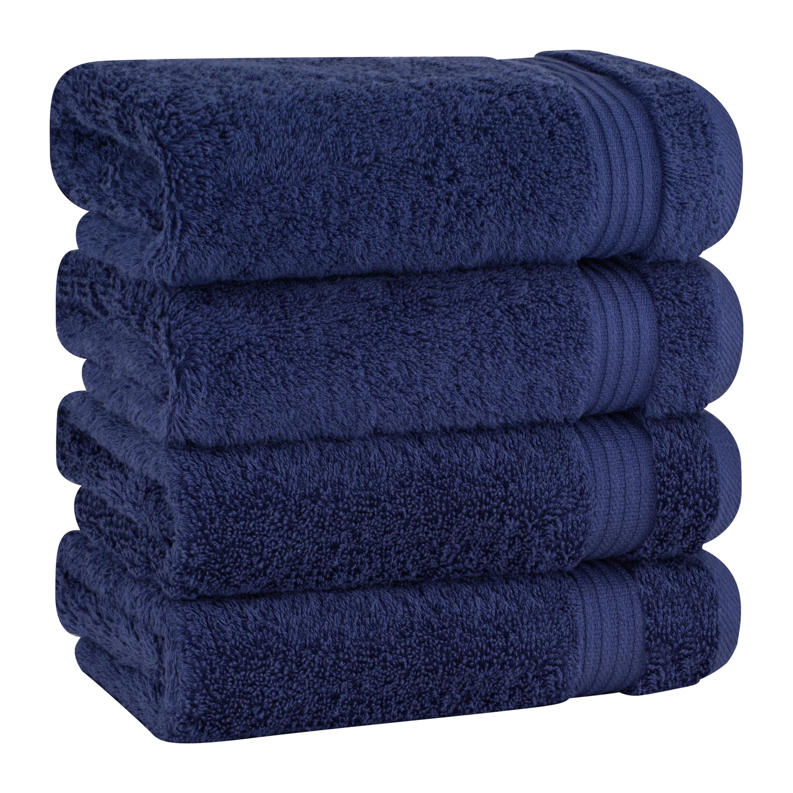 Cotton Paradise hand towels folded to show the 4-piece navy blue set's plush softness