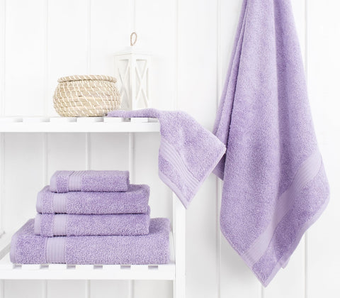 Cotton Paradise lilac towel set hand towels folded, ideal for guest hand drying.