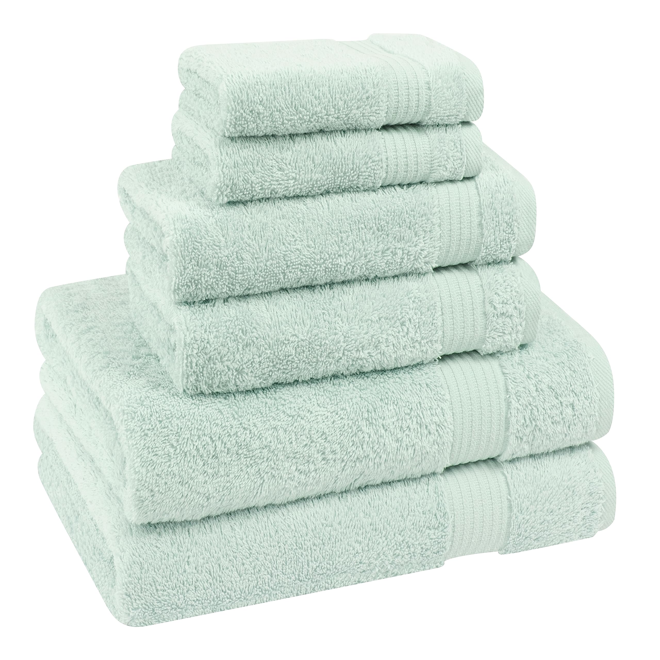Mint towels hanging in bathroom to display color and texture