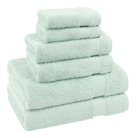 Mint towels hanging in bathroom to display color and texture