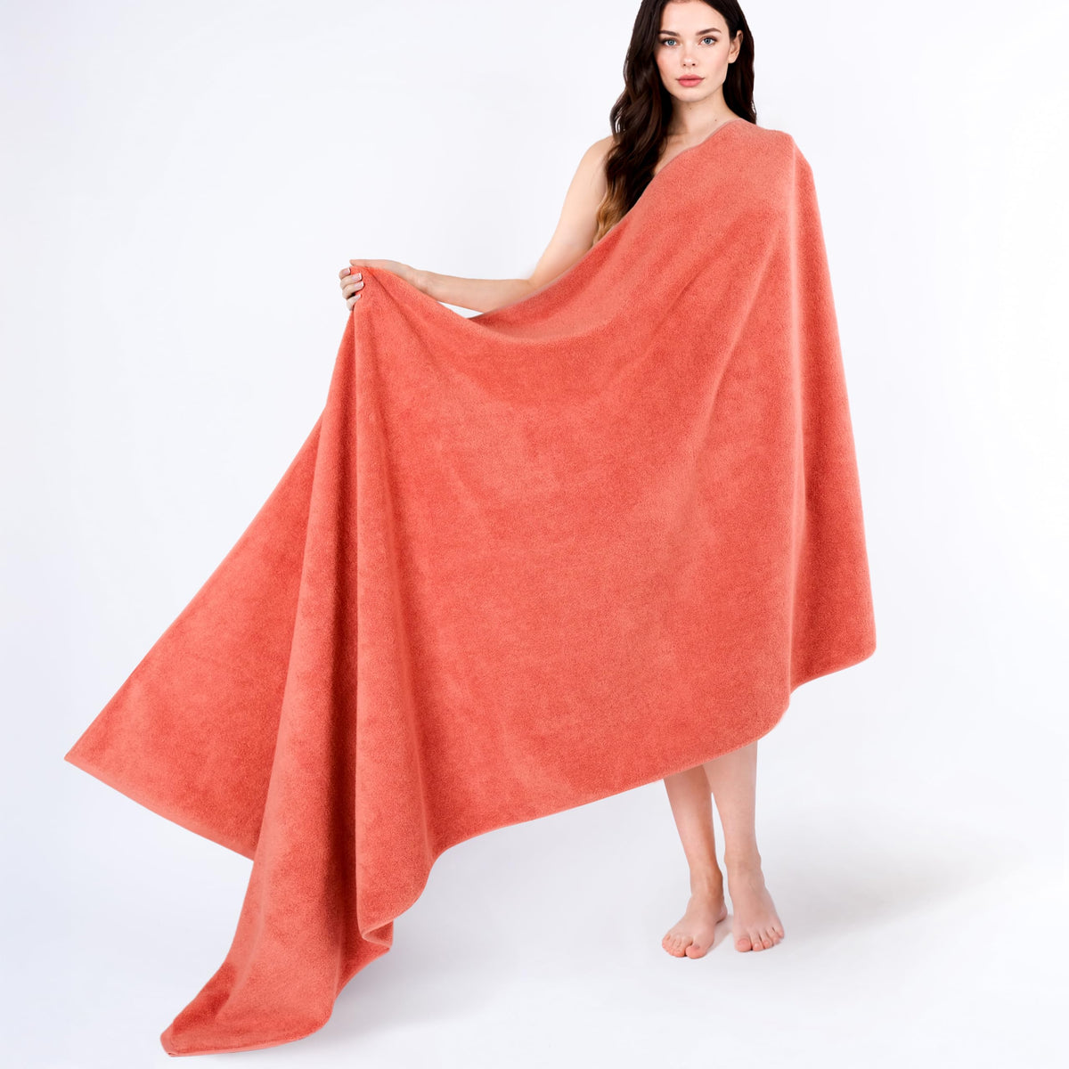 Cotton Paradise soft-absorbent Turkish towel in coral, ideal for quick drying after showers.