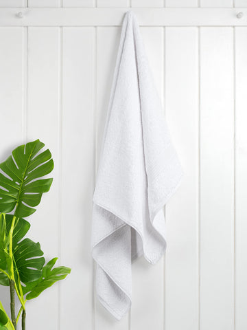 Cotton Paradise towels set on bathroom counter ready for guest use.