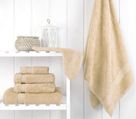 Cotton Paradise beige hand towels shown beside matching washcloths for guests.