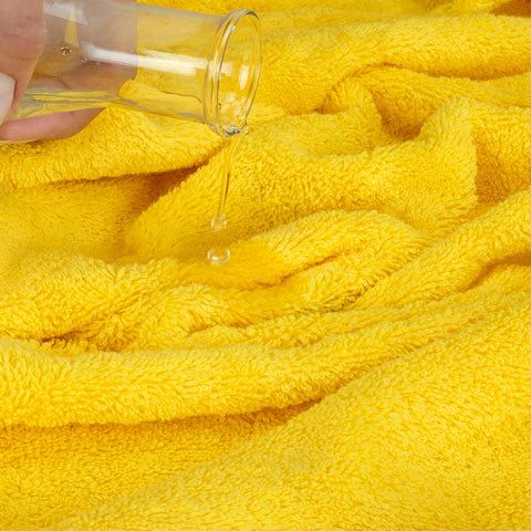 Cotton Paradise yellow towel set packaging showcases value and care.