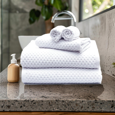 Cotton Craft hand towels arranged to convey quick-dry comfort.