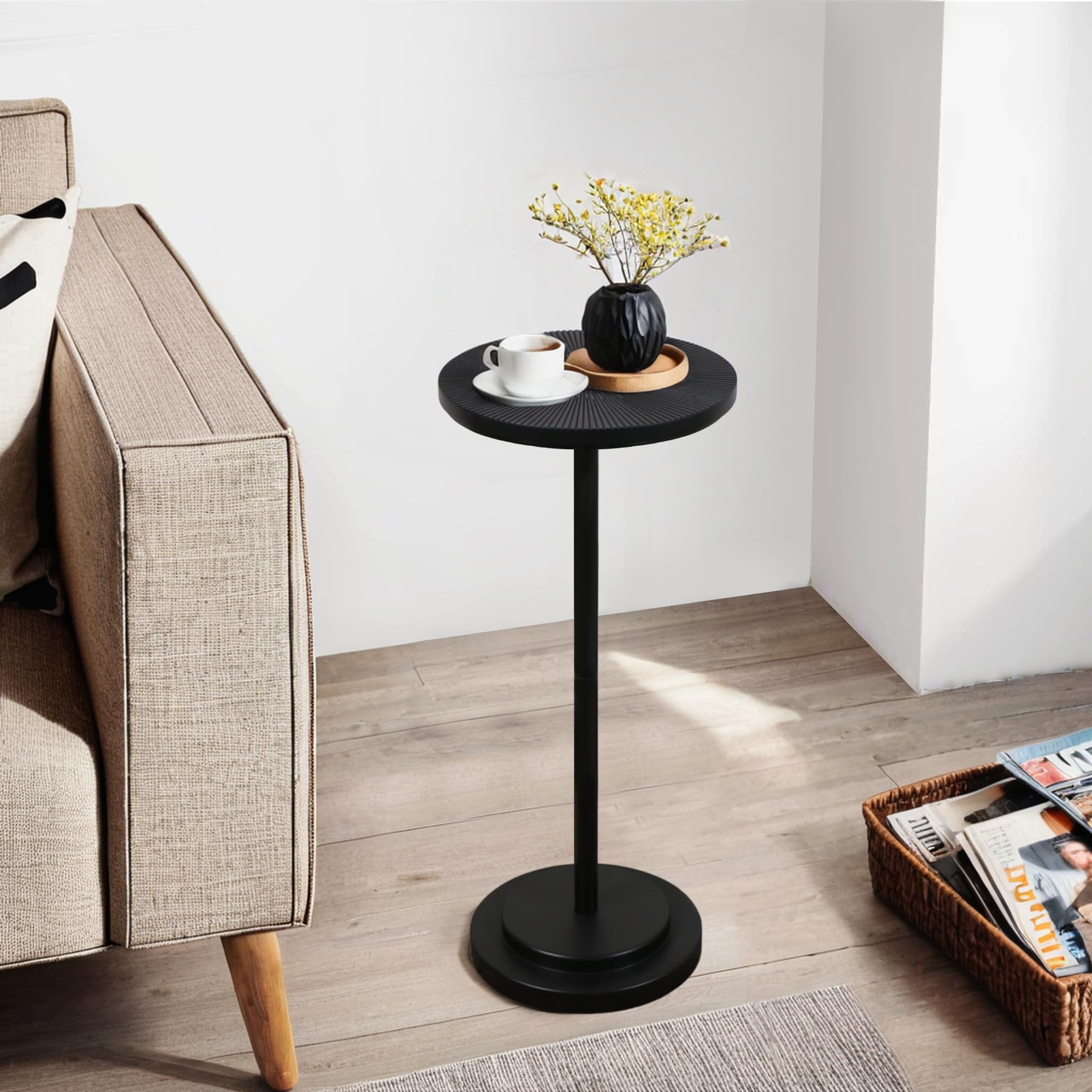 COVLON drink table with carved black top adds style to small living spaces.
