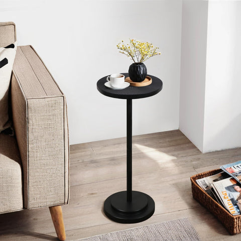 COVLON drink table with carved black top adds style to small living spaces.