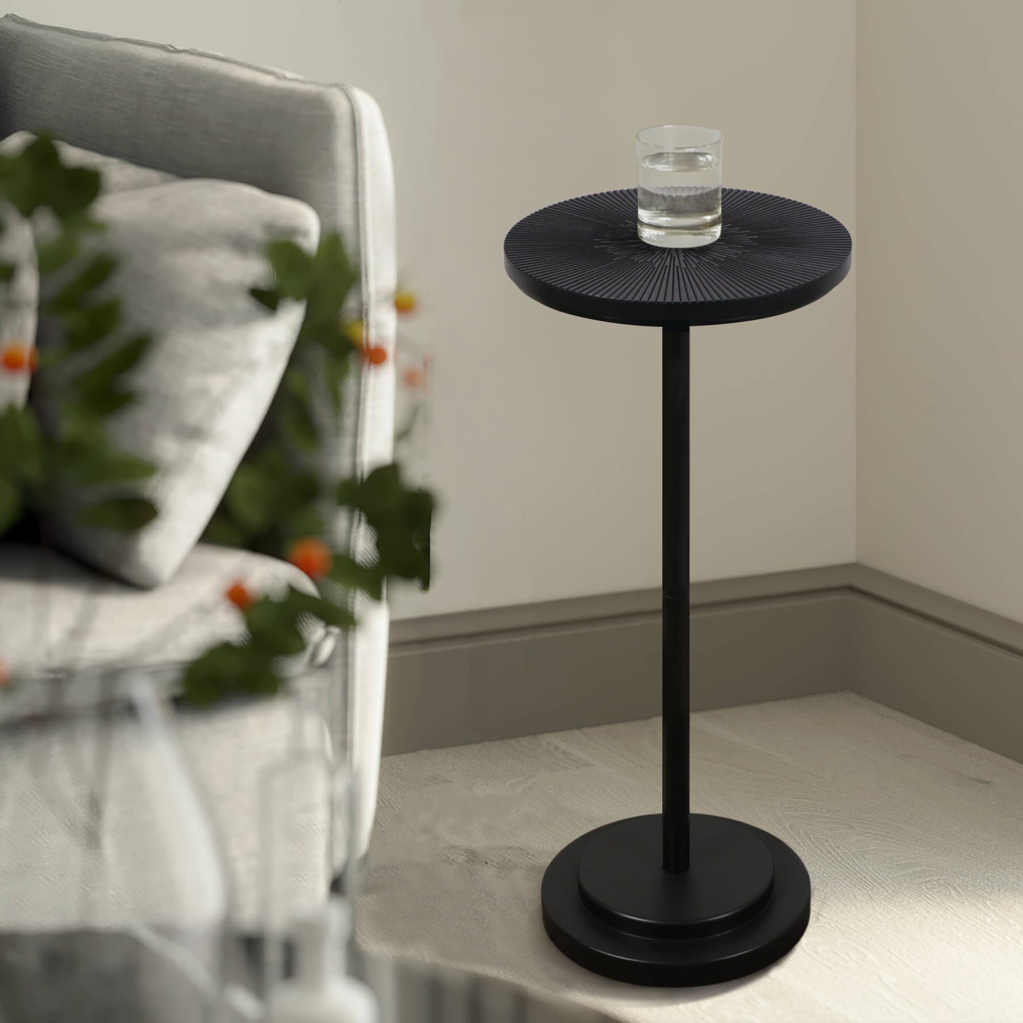 COVLON martini table on a pedestal base provides stable support for drinks and decor.