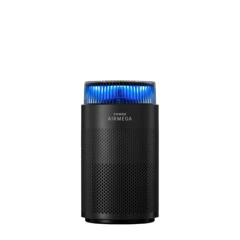 Coway air purifier in a bedroom showing expansive 810 sq ft coverage.