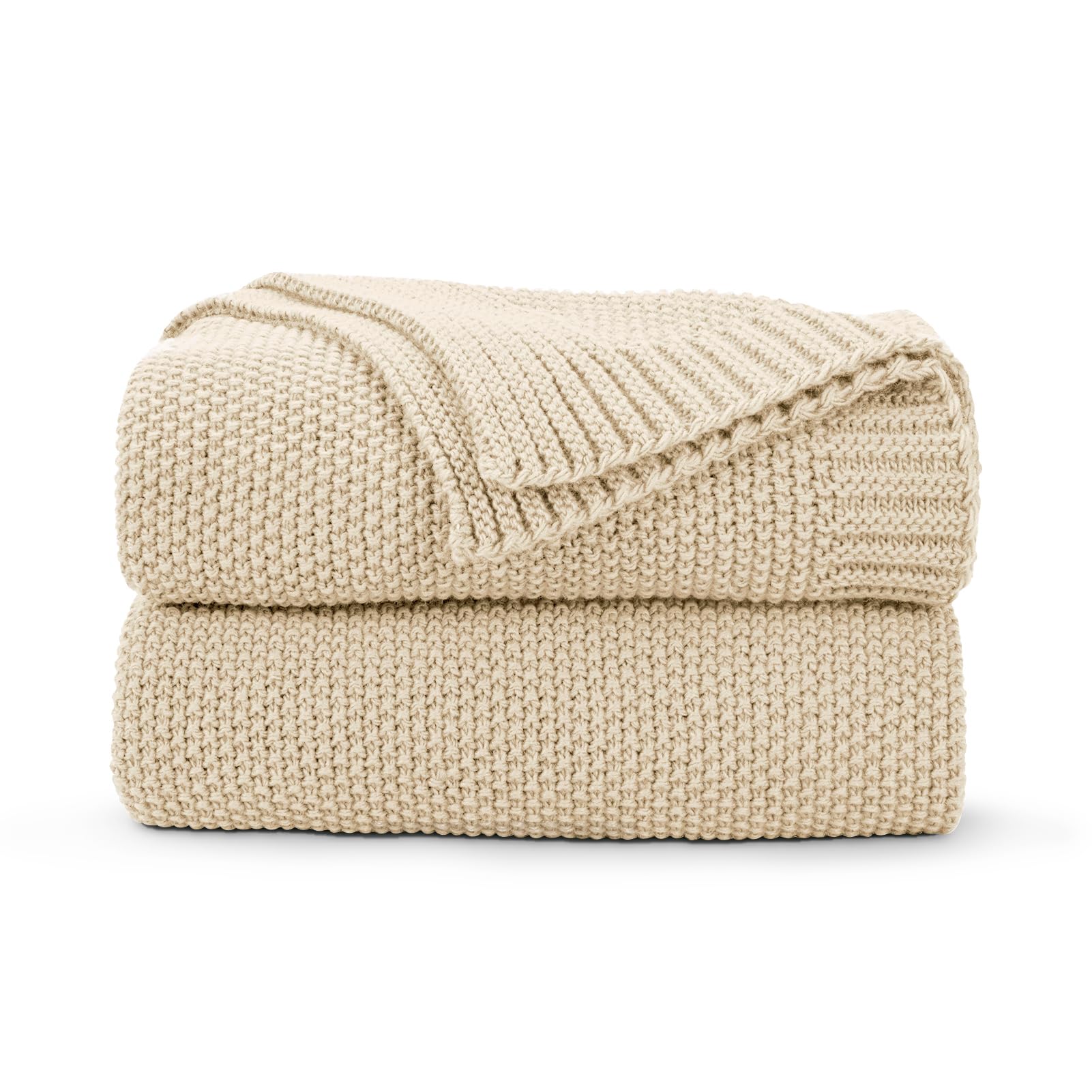 CozeCube beige throw on couch offering cozy warmth for living room evenings.