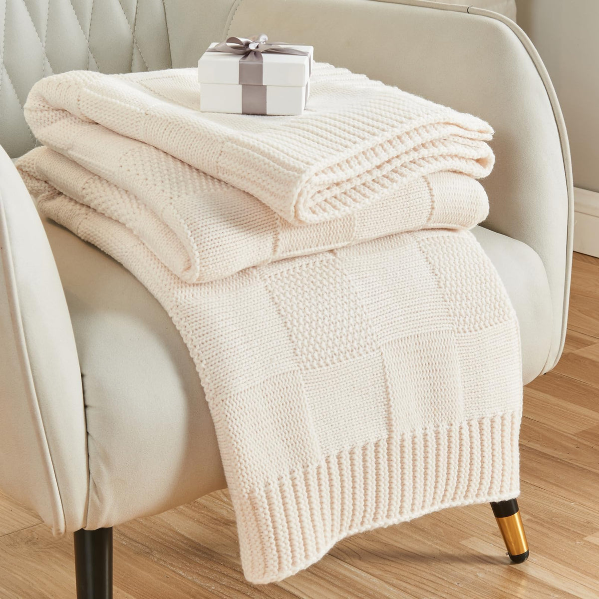CozeCube Check Knit Throw in cream white adds cozy texture to your couch.