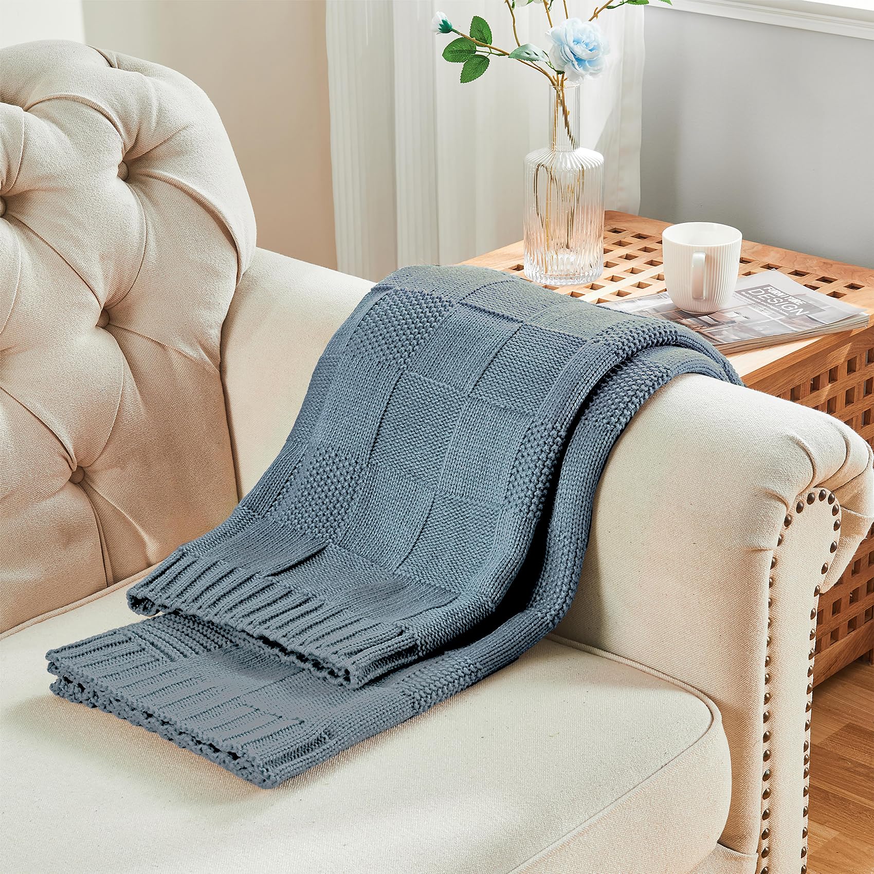 Dusty blue CozeCube blanket adds color and comfort to the living room.