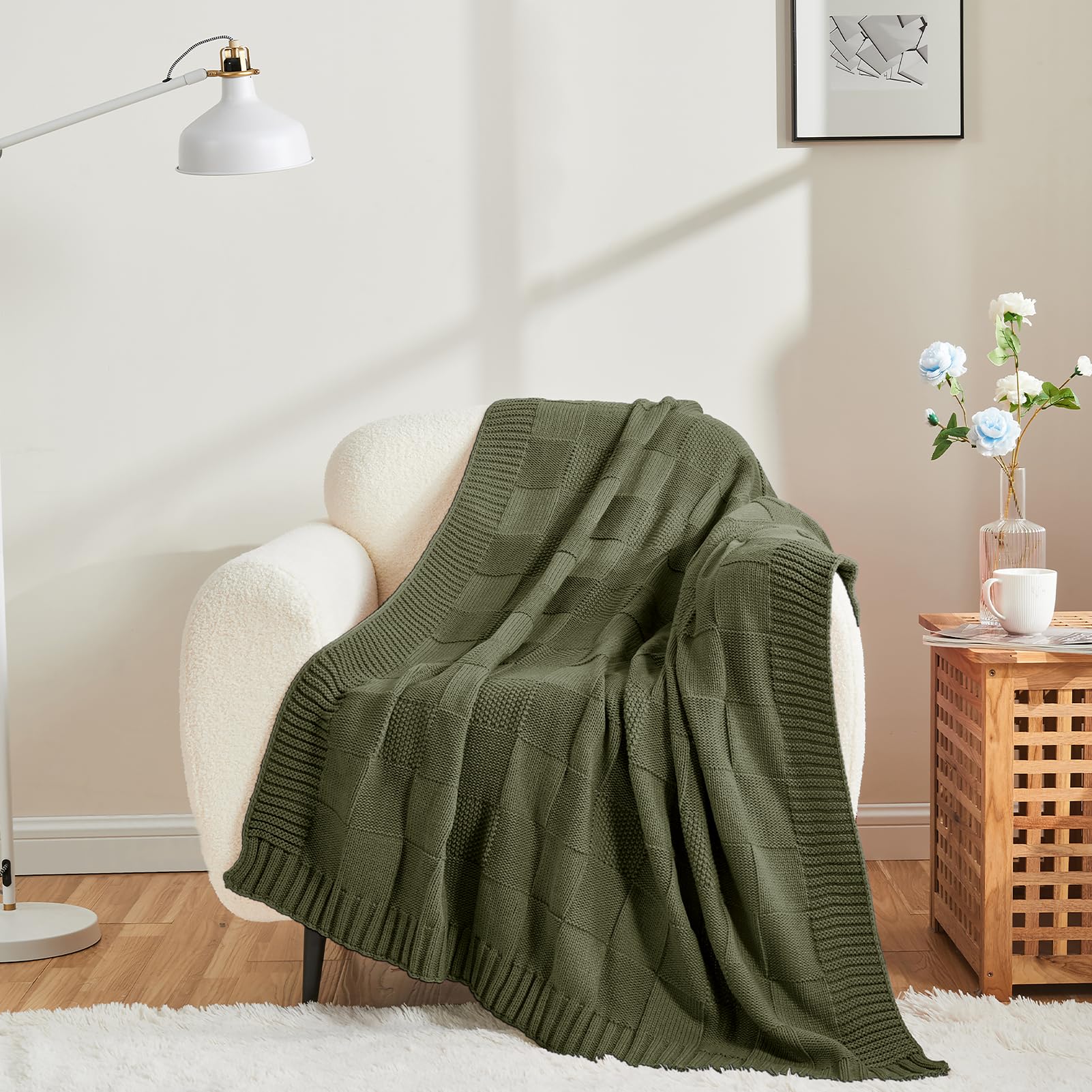 Close-up of CozeCube olive throw showing seed-stitch texture and softness