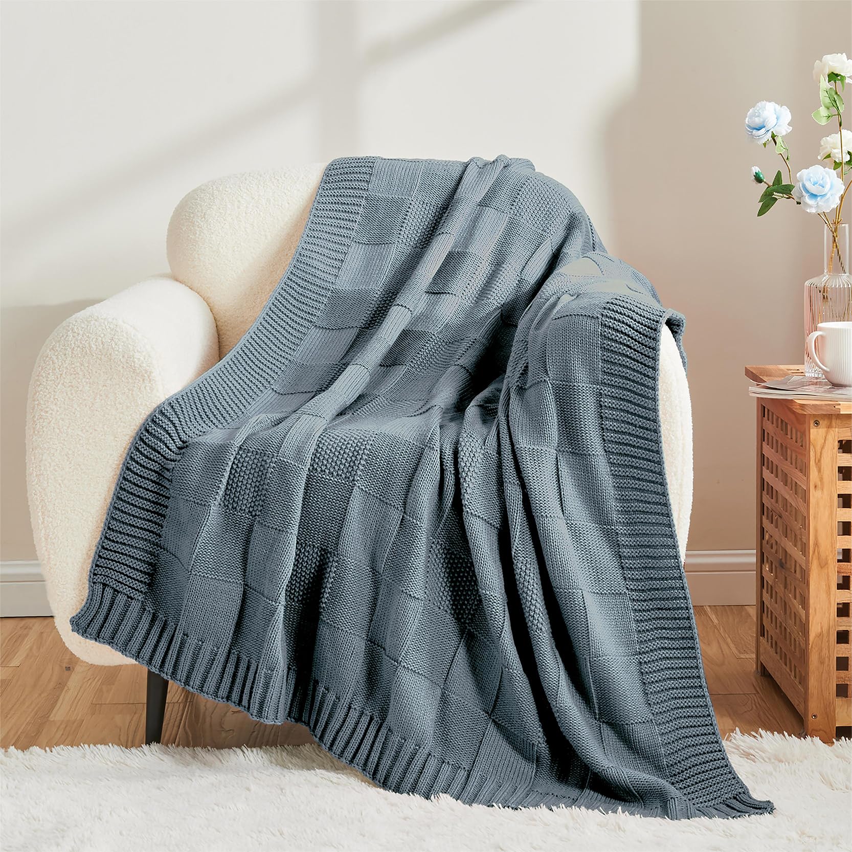 Close-up of seed-stitch detail on CozeCube throw highlights soft, breathable yarn.