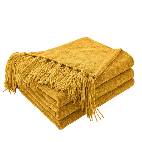 CozeCube chenille throw in harvest gold with fringe on sofa for cozy warmth