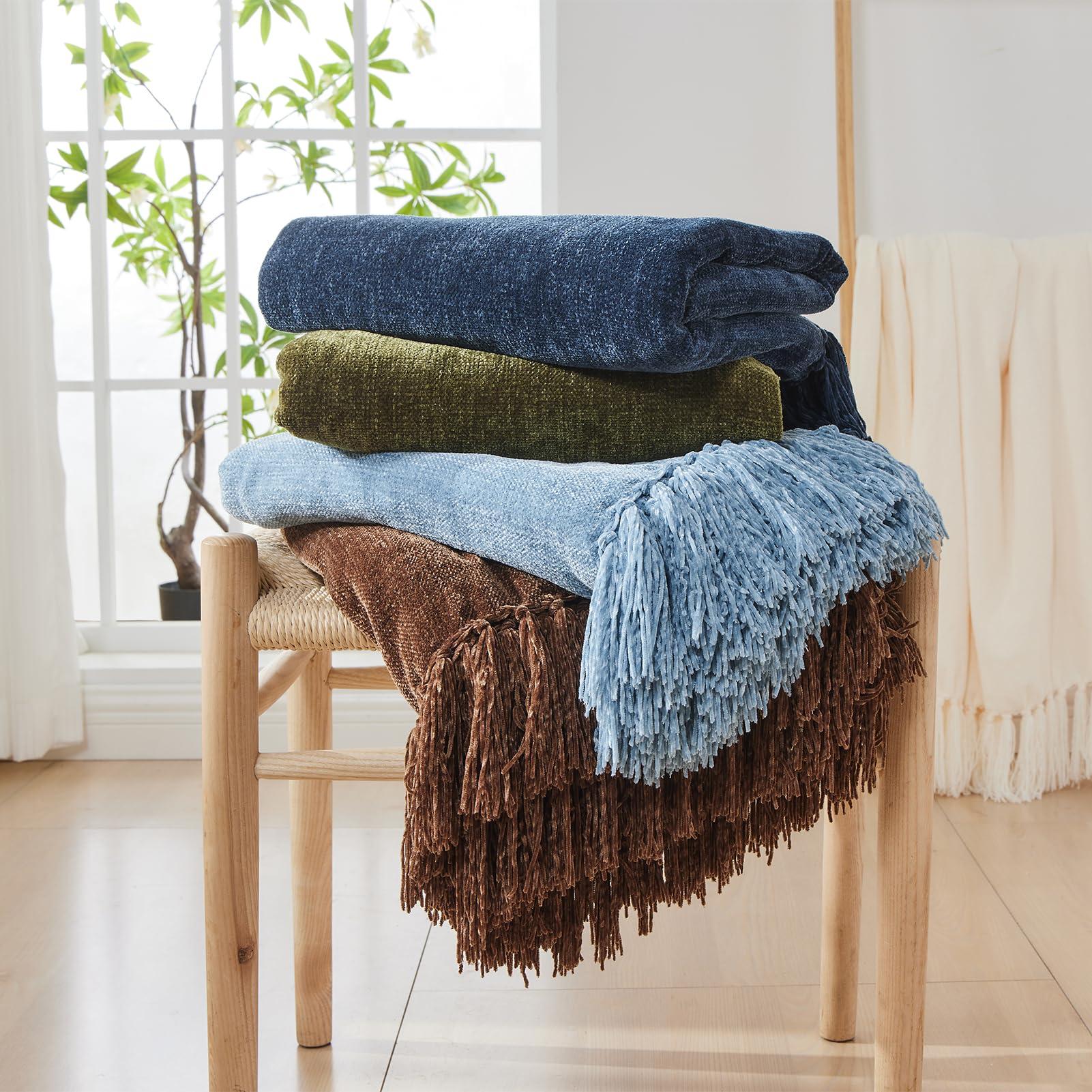 Tassel detail on CozeCube throw enhances casual couch decor