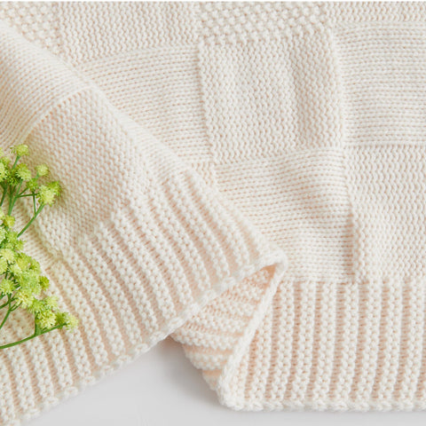 CozeCube cozy knit blanket provides warmth for evenings of TV or reading.