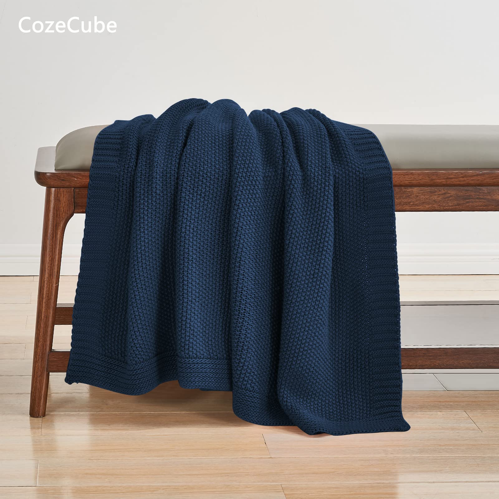 CozeCube Navy Blue Throw folded on chair offers lightweight warmth
