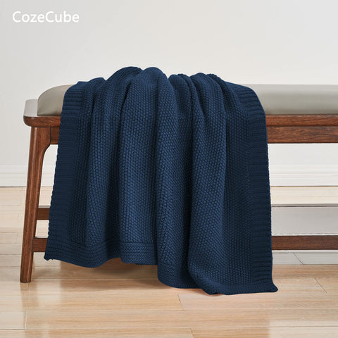 CozeCube Navy Blue Throw folded on chair offers lightweight warmth