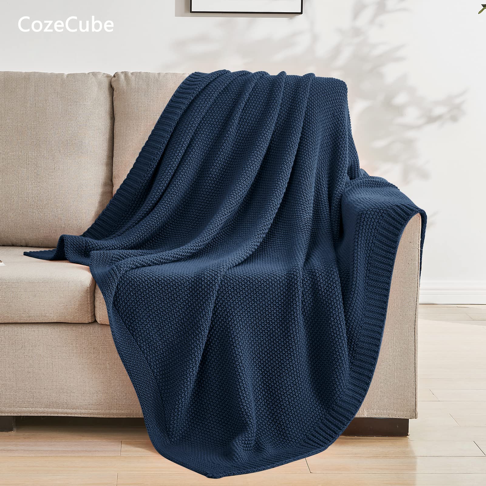 CozeCube Navy Blue Throw end-of-bed display creates inviting farmhouse decor