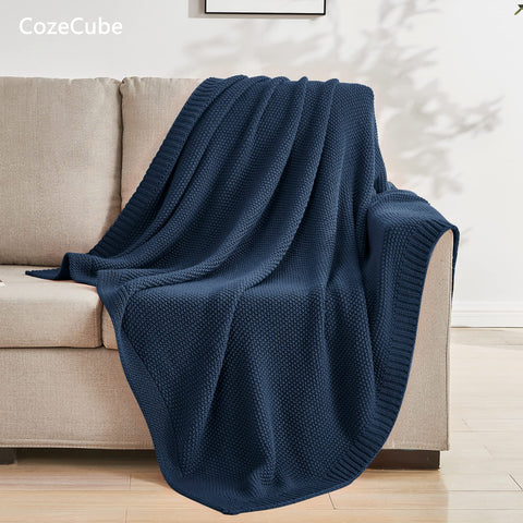 CozeCube Navy Blue Throw end-of-bed display creates inviting farmhouse decor