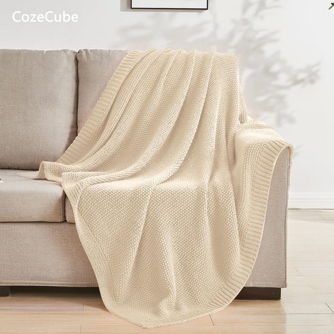 CozeCube seed-stitch knit closeup highlighting dense texture and softness.