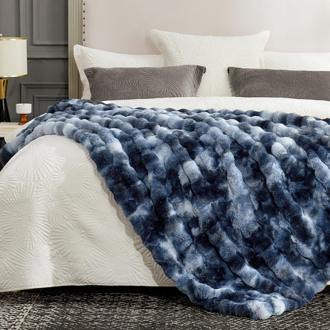 Cozy Bliss 50x60 inches blanket draped over bed—space-saving warmth and style.