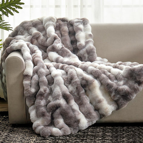 Cozy Bliss Bubble Throw face fur texture provides plush warmth on the sofa.