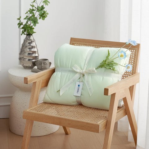 Cozy Bliss queen-size cooling blanket shown for lounging and relaxation