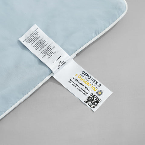 Cozy Bliss cooling comforter queen draped on chair, versatile use anywhere.